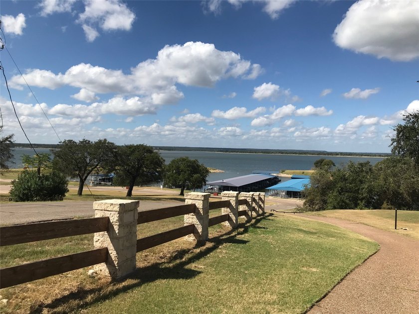 Great Lot with distant water view, partially cleared, backs up - photo 28