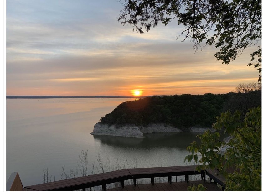 Great Lot with distant water view, partially cleared, backs up - photo 31