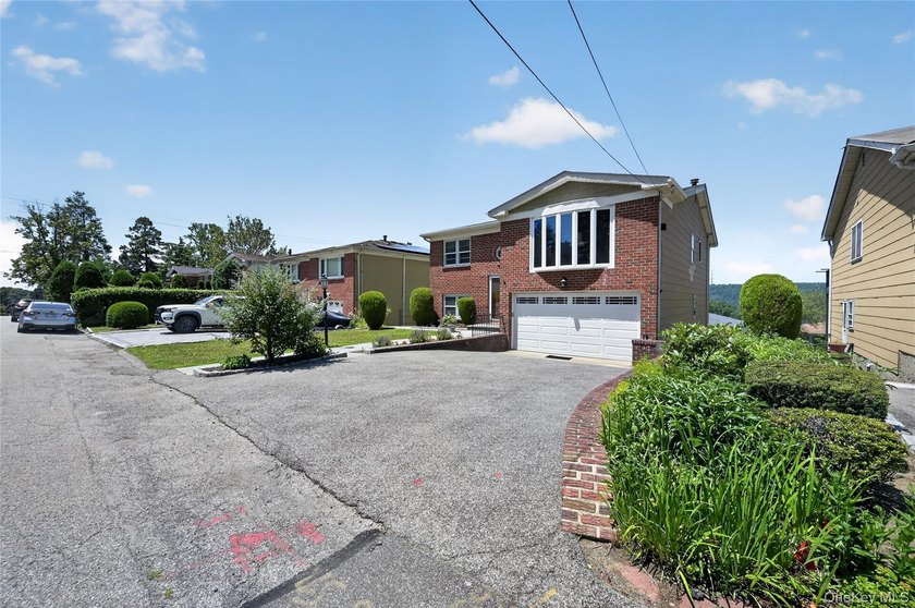 Located on a lovely, quiet street in Northwest Yonkers, this - photo 3