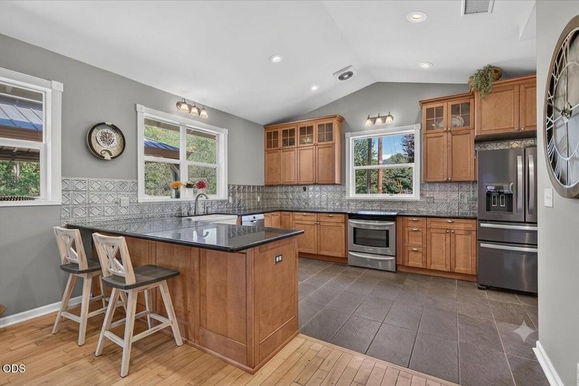 Picturesque Creekfront Farmhouse on 5.03 fully fenced acres! - photo 8