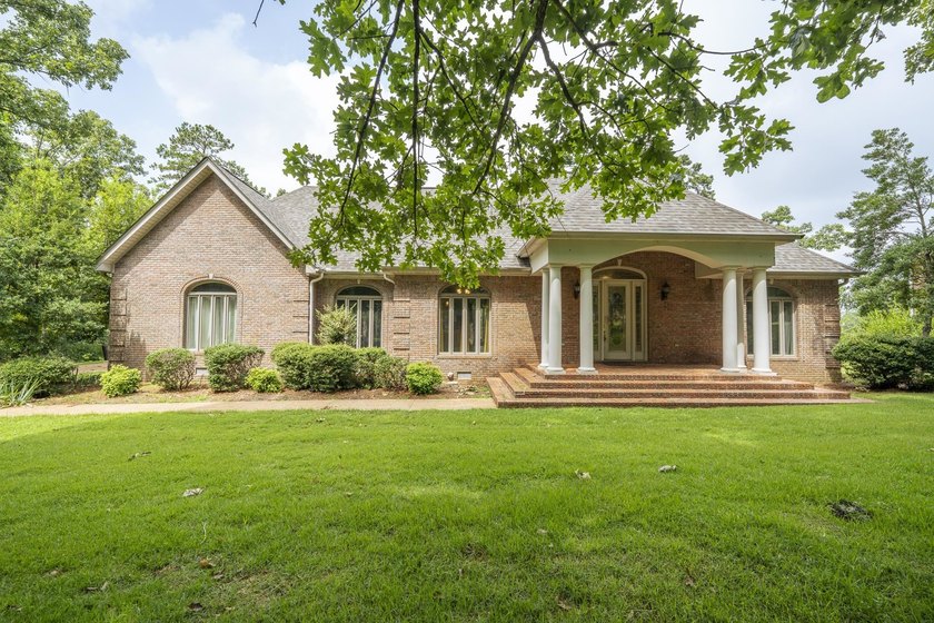 Welcome to this beautiful brick home perfectly situated on the - photo 2