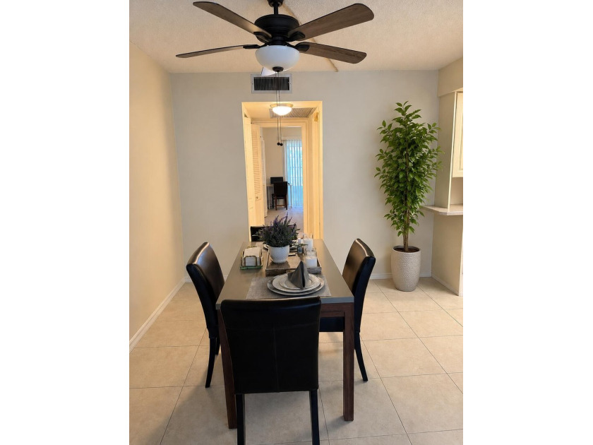 STEP INTO THIS BEAUTIFULLY MAINTAINED CONDO FILLED WITH WARMTH - photo 3