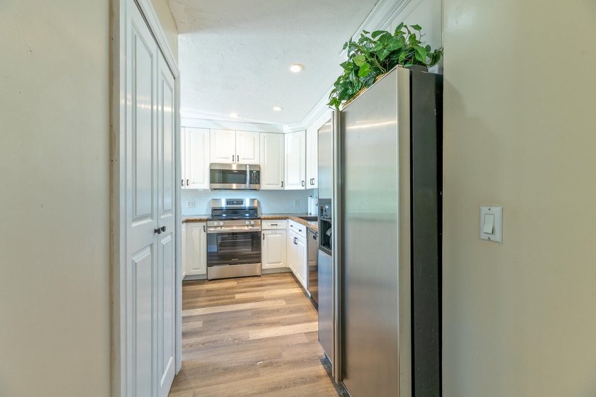 Welcome to this beautifully maintained two-story condominium in - photo 25