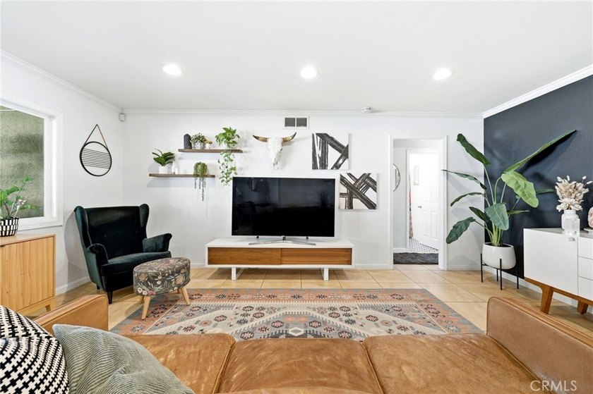 Welcome home to one of the most stylishly designed homes on the - photo 3