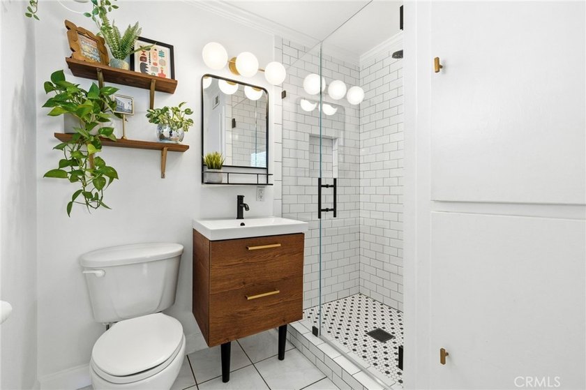 Welcome home to one of the most stylishly designed homes on the - photo 5