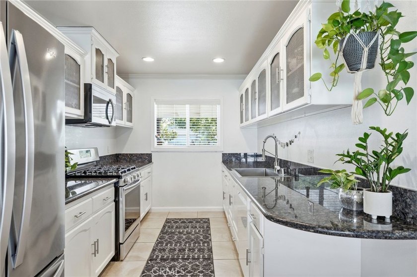 Welcome home to one of the most stylishly designed homes on the - photo 7