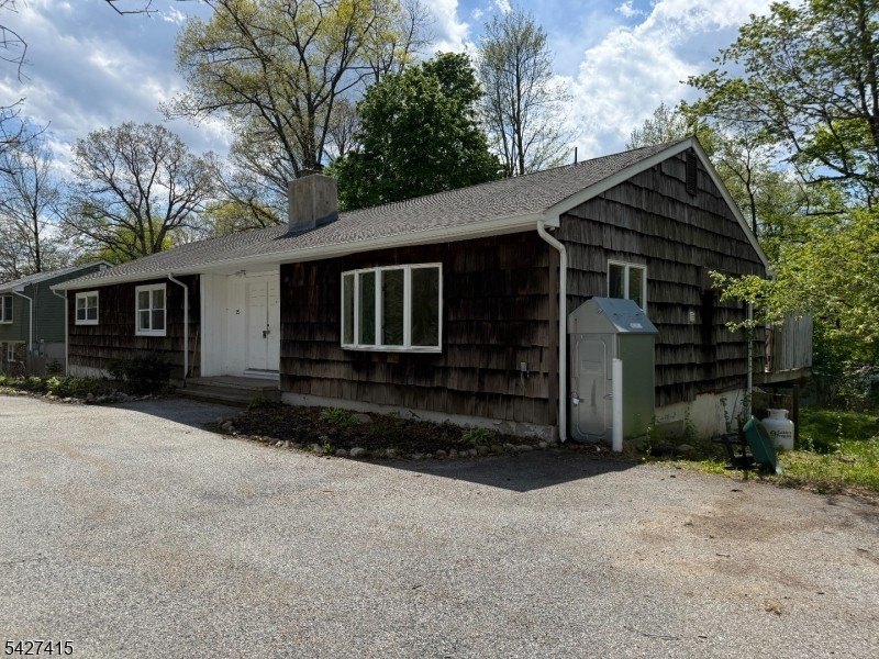 Welcome to this spacious four-bedroom ranch nestled in the - photo 2
