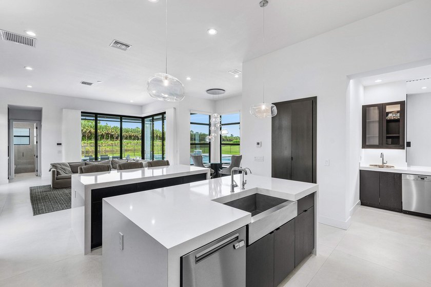 Nestled behind the prestigious gates of Boca Bridges, this - photo 14
