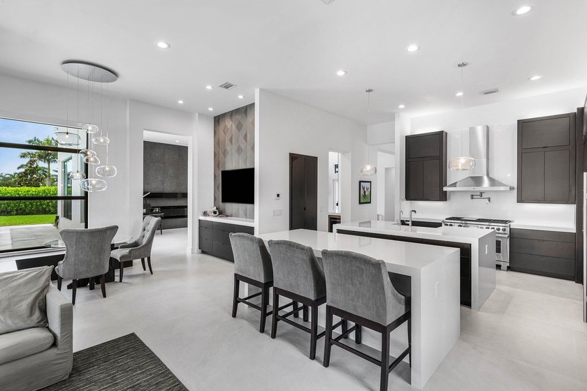 Nestled behind the prestigious gates of Boca Bridges, this - photo 15