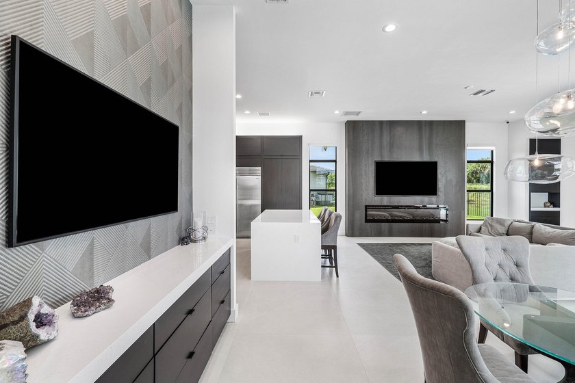 Nestled behind the prestigious gates of Boca Bridges, this - photo 17