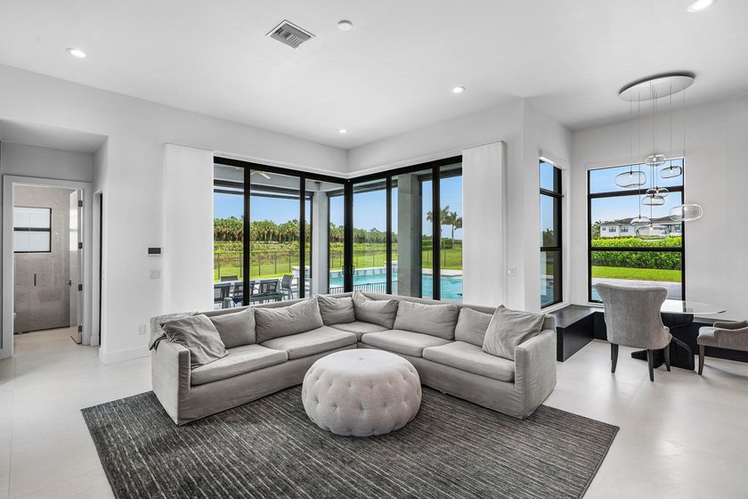 Nestled behind the prestigious gates of Boca Bridges, this - photo 20