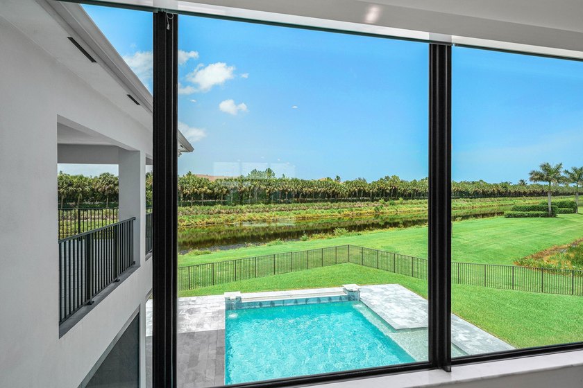 Nestled behind the prestigious gates of Boca Bridges, this - photo 28