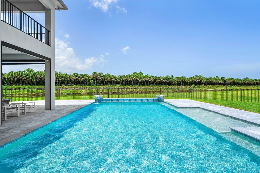 Nestled behind the prestigious gates of Boca Bridges, this - photo 36