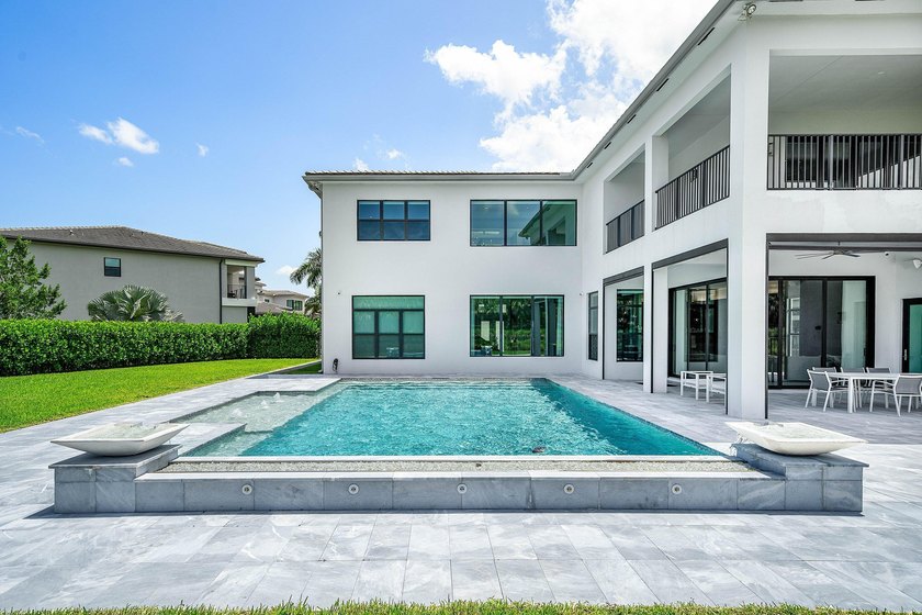 Nestled behind the prestigious gates of Boca Bridges, this - photo 38