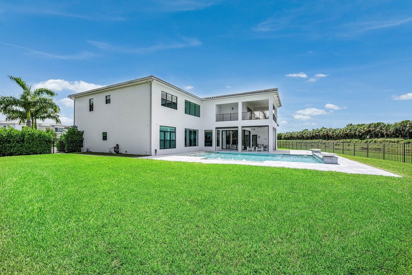 Nestled behind the prestigious gates of Boca Bridges, this - photo 39