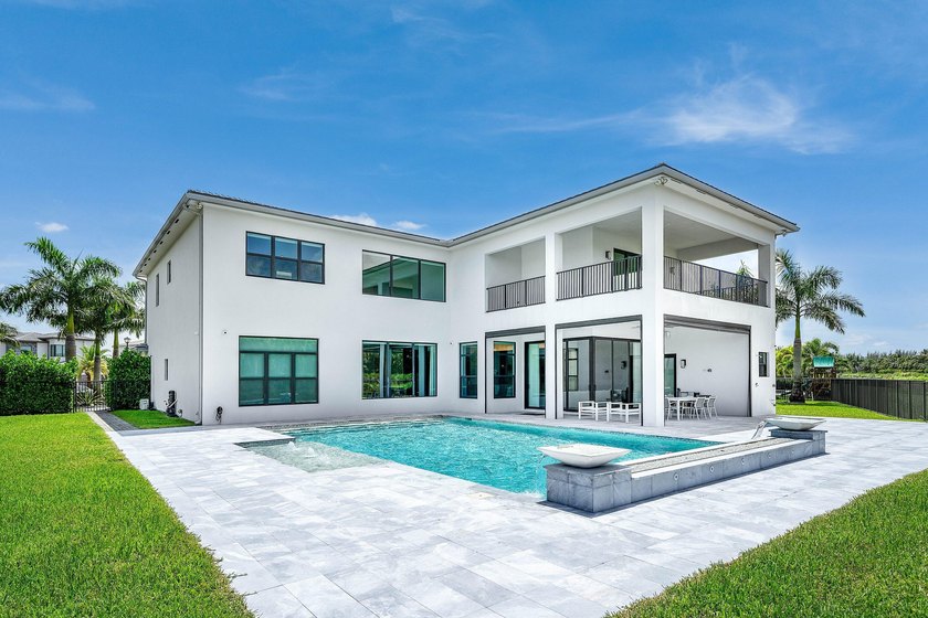 Nestled behind the prestigious gates of Boca Bridges, this - photo 40