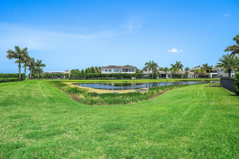 Nestled behind the prestigious gates of Boca Bridges, this - photo 41