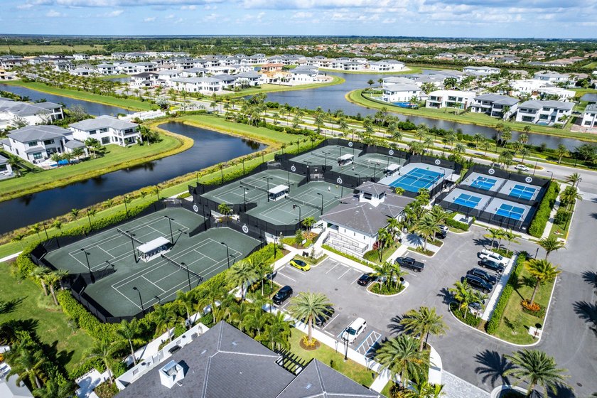 Nestled behind the prestigious gates of Boca Bridges, this - photo 49