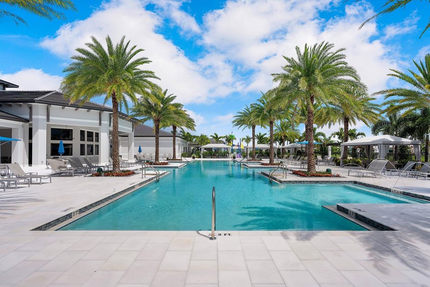 Nestled behind the prestigious gates of Boca Bridges, this - photo 50