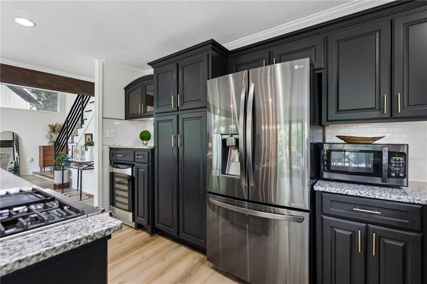 Beautiful 1.5 story home with rare attached 2 car garage in this - photo 3