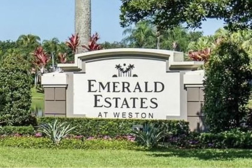 Welcome to this charming residence in the highly desirable gated - photo 3