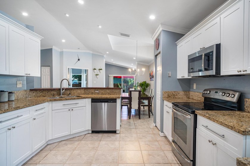 Welcome to this charming residence in the highly desirable gated - photo 10