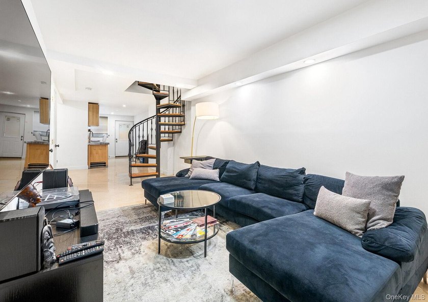 Welcome to 41 Claver Place, a remarkable three-family townhouse - photo 4