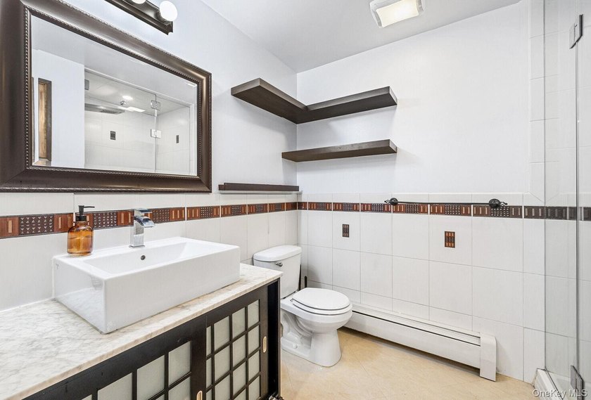 Welcome to 41 Claver Place, a remarkable three-family townhouse - photo 6