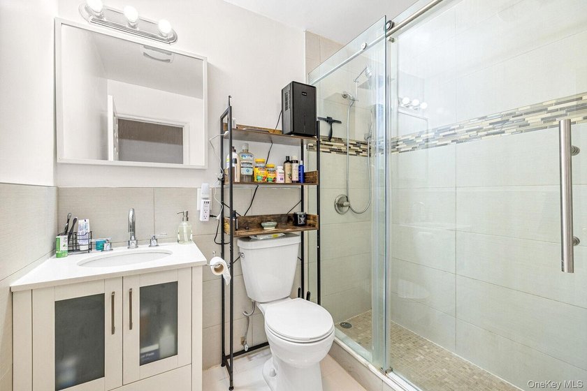 Welcome to 41 Claver Place, a remarkable three-family townhouse - photo 9