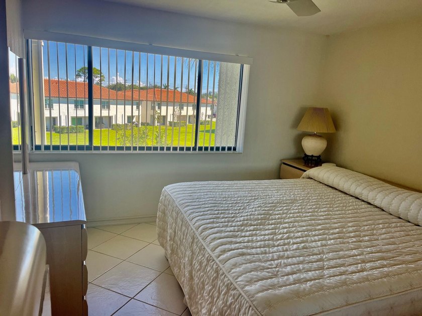 Welcome to this charming two-bedroom, two-bathroom condominium - photo 15