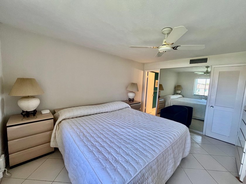 Welcome to this charming two-bedroom, two-bathroom condominium - photo 16