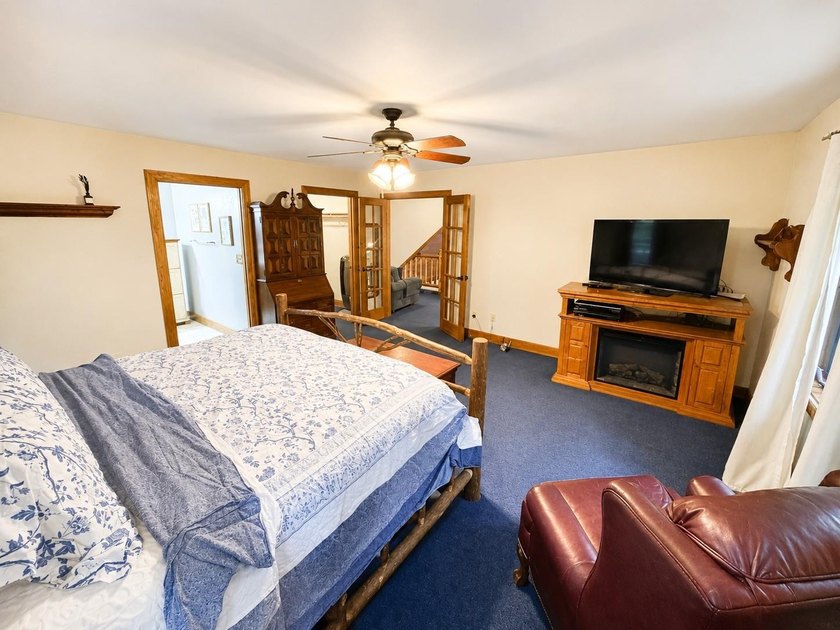 Escape to the Northwoods with this inviting half-log home on - photo 17