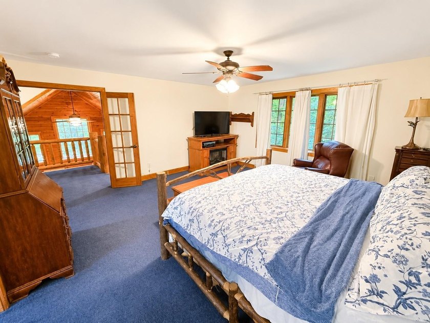 Escape to the Northwoods with this inviting half-log home on - photo 18