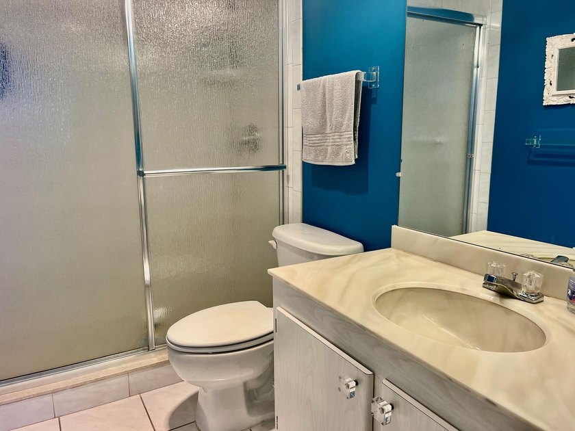 Welcome to this charming two-bedroom, two-bathroom condominium - photo 18