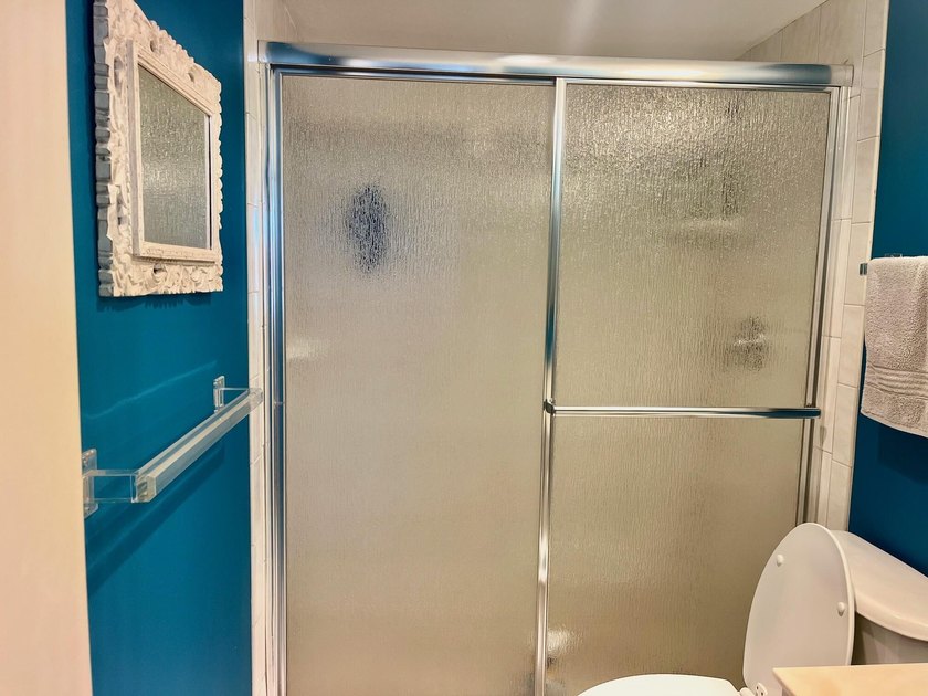 Welcome to this charming two-bedroom, two-bathroom condominium - photo 19