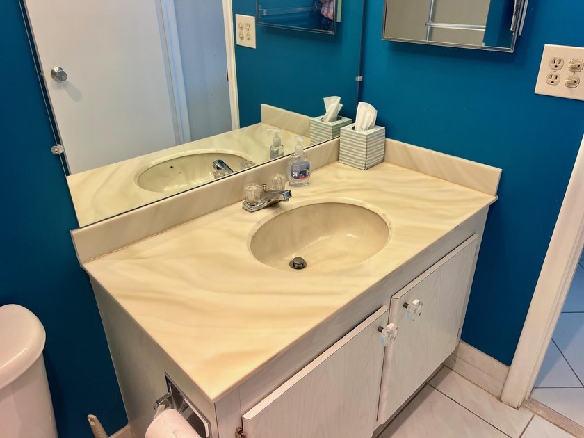 Welcome to this charming two-bedroom, two-bathroom condominium - photo 20