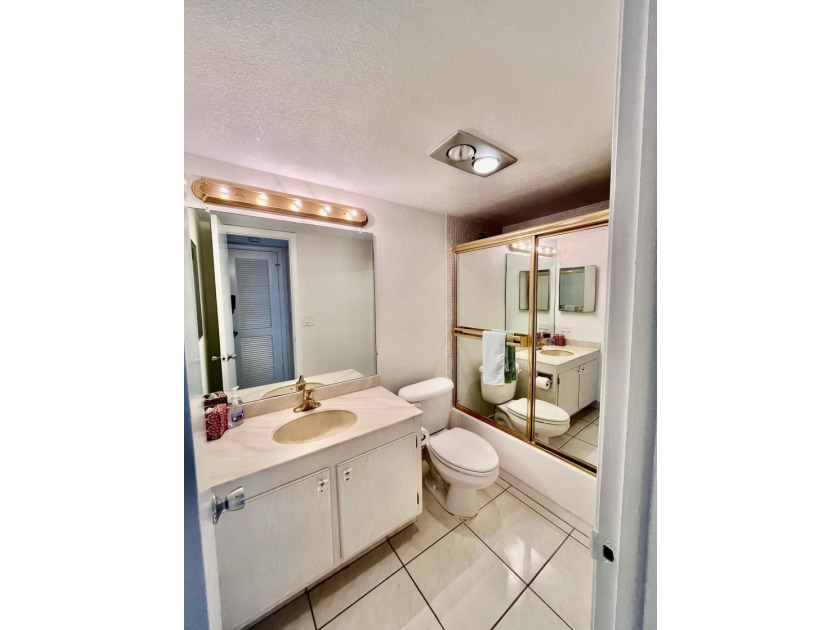 Welcome to this charming two-bedroom, two-bathroom condominium - photo 25