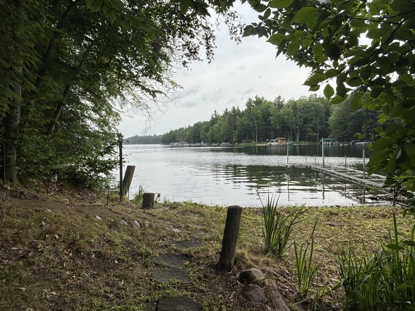 Escape to the Northwoods with this inviting half-log home on - photo 28