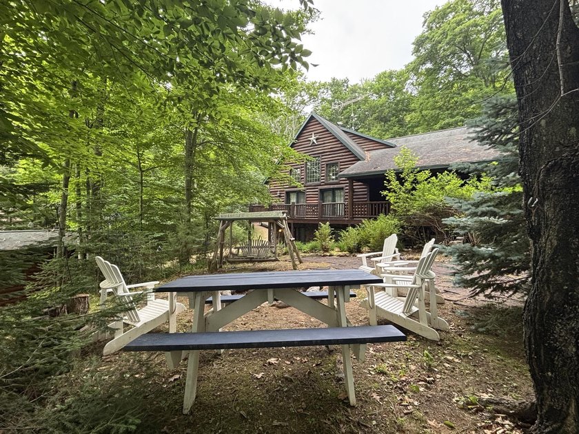 Escape to the Northwoods with this inviting half-log home on - photo 33