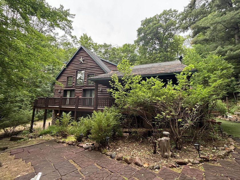 Escape to the Northwoods with this inviting half-log home on - photo 35