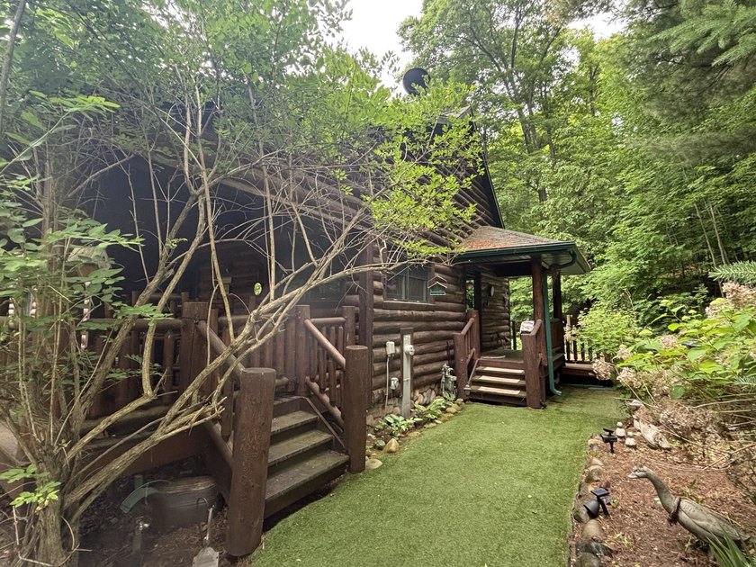 Escape to the Northwoods with this inviting half-log home on - photo 37