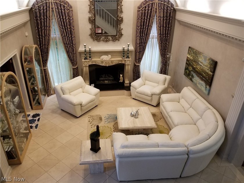 Step into an extraordinary two-story foyer where timeless - photo 5