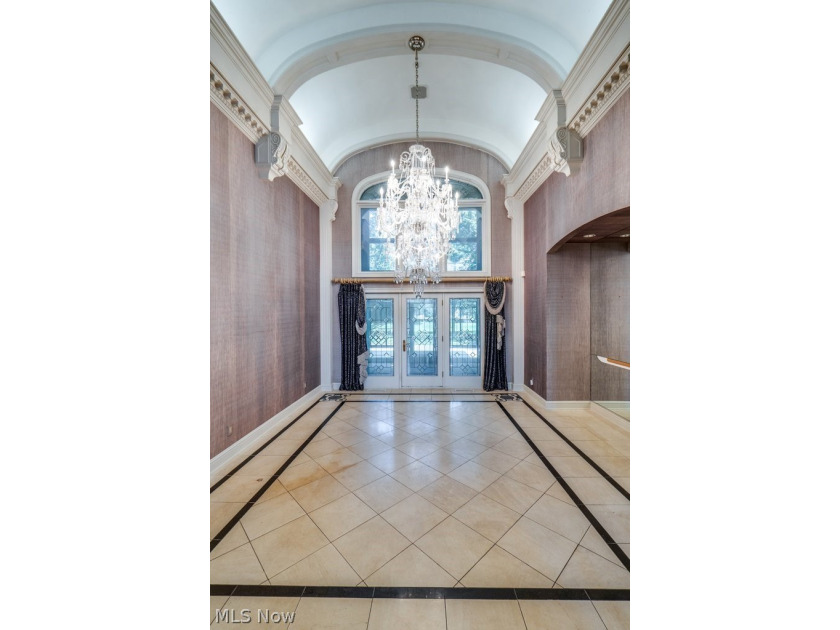 Step into an extraordinary two-story foyer where timeless - photo 6