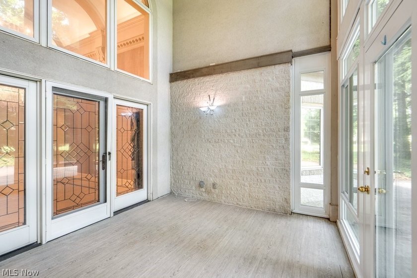 Step into an extraordinary two-story foyer where timeless - photo 8