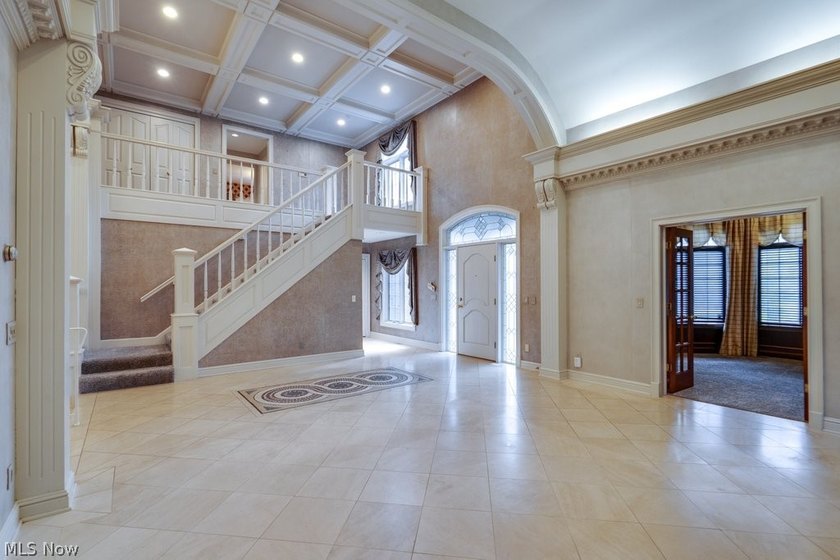Step into an extraordinary two-story foyer where timeless - photo 9