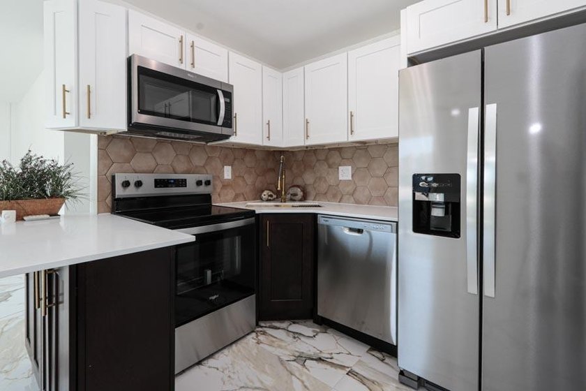 Step into a home where *renovated* is an understatement-it's - photo 7