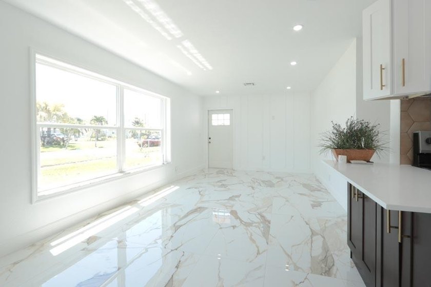 Step into a home where *renovated* is an understatement-it's - photo 8