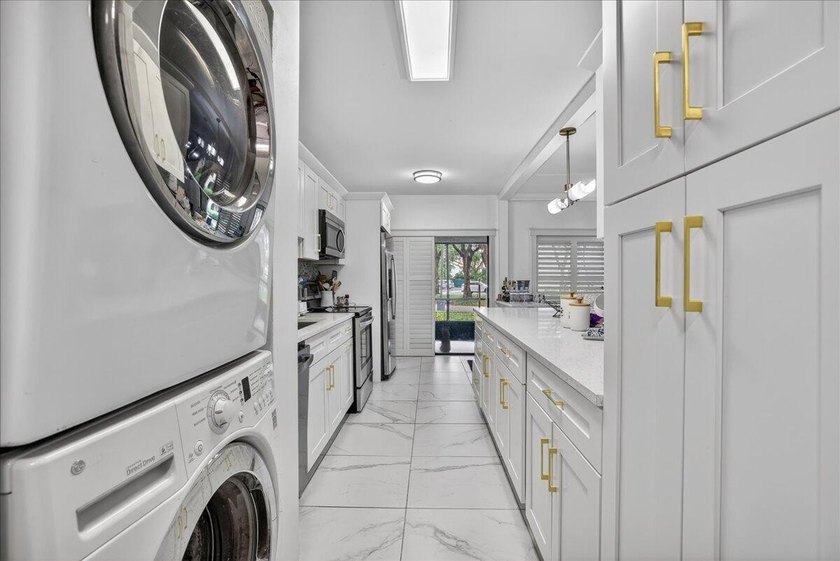 This spacious 2/2 ground-floor condo offers the perfect blend of - photo 9