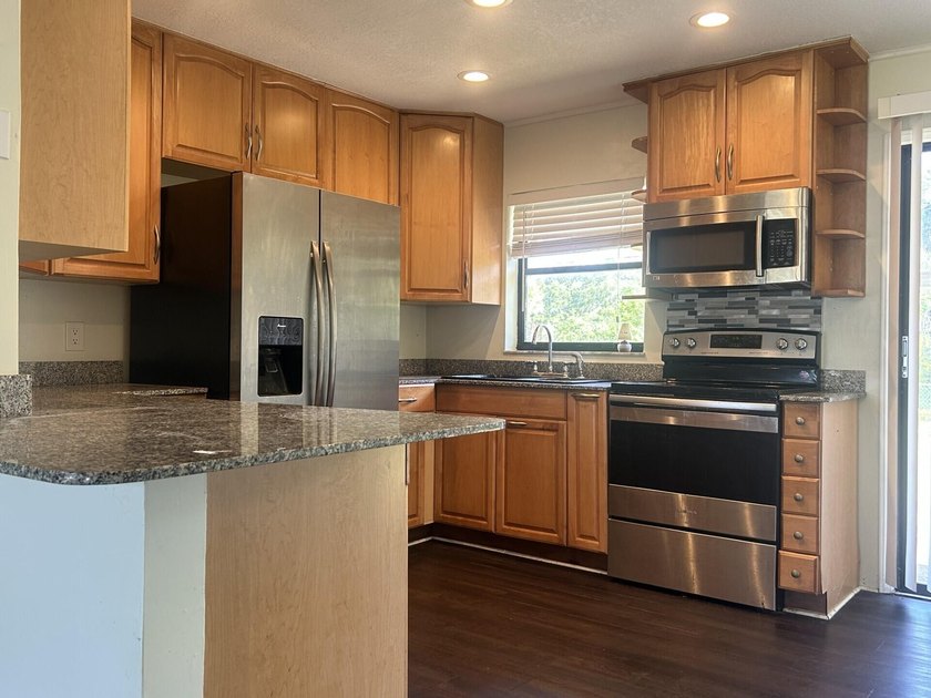 Discover this solid 2-bedroom, 2-bath CBS home with a 1-car - photo 6