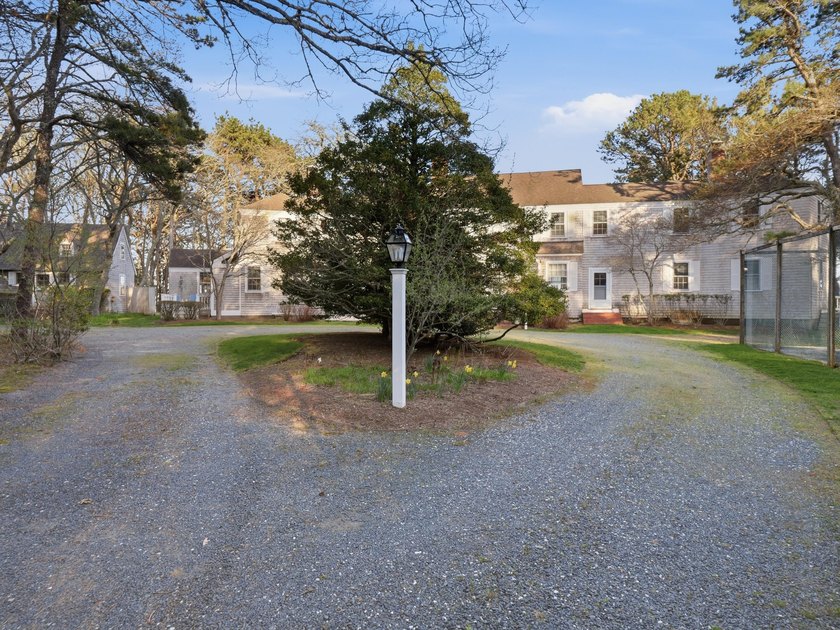 In the lovely enclaves of Cotuit, Ma, positioned on a - photo 13
